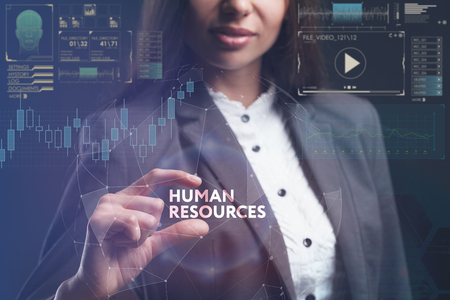 The concept of business, technology, the Internet and the network. A young entrepreneur working on a virtual screen of the future and sees the inscription: Human resourcesの写真素材