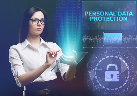 The concept of business, technology, the Internet and the network. A young entrepreneur working on a virtual screen of the future and sees the inscription: Personal data protectionの写真素材
