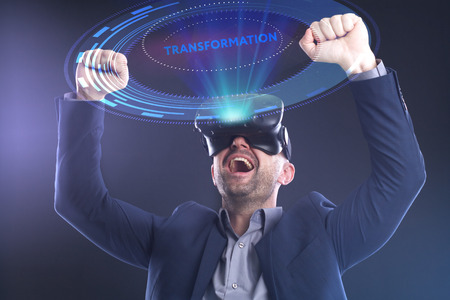 The concept of business, technology, the Internet and the network. A young entrepreneur working on a virtual screen of the future and sees the inscription: Transformationの写真素材
