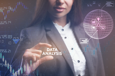 The concept of business, technology, the Internet and the network. A young entrepreneur working on a virtual screen of the future and sees the inscription: Data analysisの写真素材