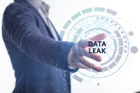 The concept of business, technology, the Internet and the network. A young entrepreneur working on a virtual screen of the future and sees the inscription: Data leakの写真素材