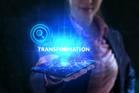 The concept of business, technology, the Internet and the network. A young entrepreneur working on a virtual screen of the future and sees the inscription: Transformationの写真素材