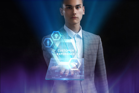 The concept of business, technology, the Internet and the network. A young entrepreneur working on a virtual screen of the future and sees the inscription: Customer experienceの写真素材