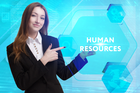 The concept of business, technology, the Internet and the network. A young entrepreneur working on a virtual screen of the future and sees the inscription: Human resourcesの写真素材