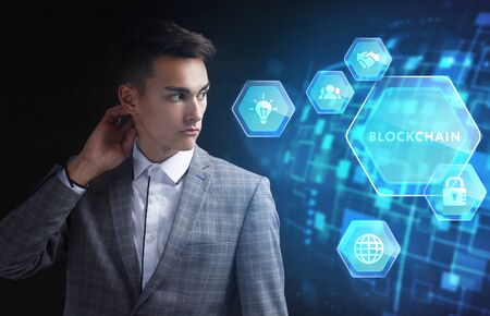 The concept of business, technology, the Internet and the network. A young entrepreneur working on a...