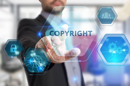 The concept of business, technology, the Internet and the network. A young entrepreneur working on a virtual screen of the future and sees the inscription: Copyrightの写真素材