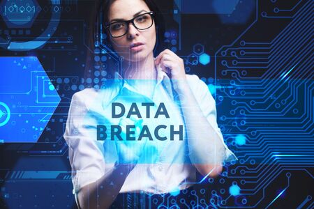 The concept of business, technology, the Internet and the network. A young entrepreneur working on a virtual screen of the future and sees the inscription: Data breachの写真素材