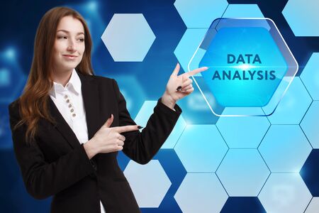 The concept of business, technology, the Internet and the network. A young entrepreneur working on a virtual screen of the future and sees the inscription: Data analysisの写真素材
