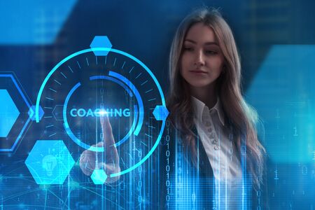 The concept of business, technology, the Internet and the network. A young entrepreneur working on a virtual screen of the future and sees the inscription: Coachingの写真素材