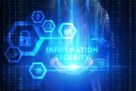 The concept of business, technology, the Internet and the network. A young entrepreneur working on a virtual screen of the future and sees the inscription: Information securityの写真素材