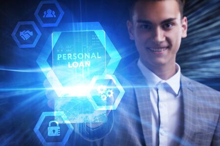 The concept of business, technology, the Internet and the network. A young entrepreneur working on a virtual screen of the future and sees the inscription: Personal loanの写真素材