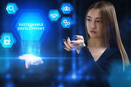 The concept of business, technology, the Internet and the network. A young entrepreneur working on a virtual screen of the future and sees the inscription: Sustainable developmentの写真素材