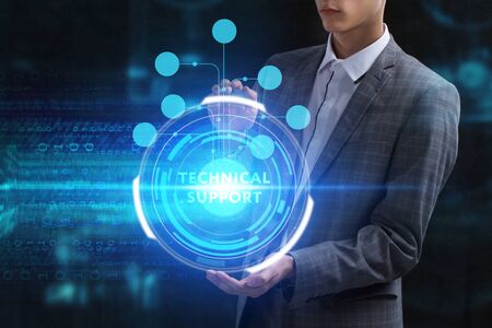 The concept of business, technology, the Internet and the network. A young entrepreneur working on a virtual screen of the future and sees the inscription: Technical supportの写真素材