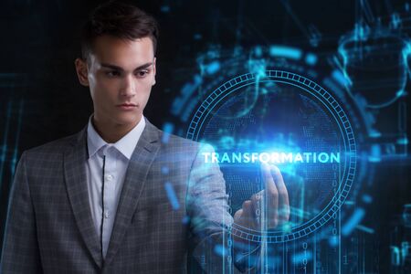 The concept of business, technology, the Internet and the network. A young entrepreneur working on a virtual screen of the future and sees the inscription: Transformationの写真素材