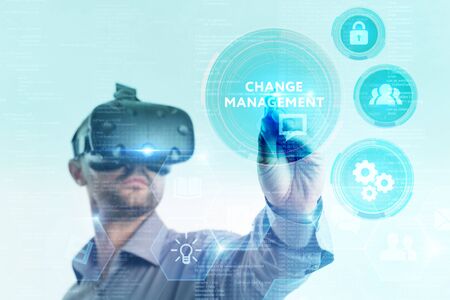 Business, Technology, Internet and network concept. Young businessman working on a virtual screen of the future and sees the inscription: の写真素材