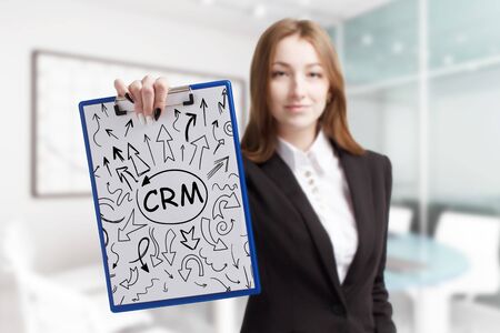 Business, technology, internet and network concept. Young businessman shows a keyword: B2Bの写真素材