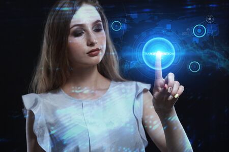 Business, Technology, Internet and network concept. Young businessman working on a virtual screen of the future and sees the inscription: Transformationの写真素材