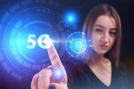 Business, Technology, Internet and network concept. Young businessman working on a virtual screen of the future and sees the inscription:の写真素材