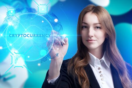 Business, Technology, Internet and network concept. Young businessman working on a virtual screen of the future and sees the inscription: Cryptocurrencyの写真素材