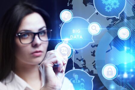 Business, Technology, Internet and network concept. Young businessman working on a virtual screen of the future and sees the inscription: Big dataの写真素材
