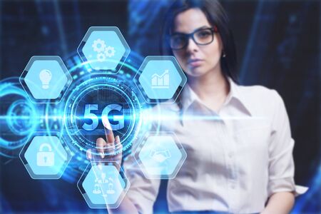 Business, Technology, Internet and network concept. Young businessman working on a virtual screen of the future and sees the inscription: 5Gの写真素材