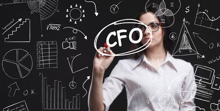 Business, Technology, Internet and network concept. Young businessman working on a virtual screen of the future and sees the inscription: CFOの写真素材