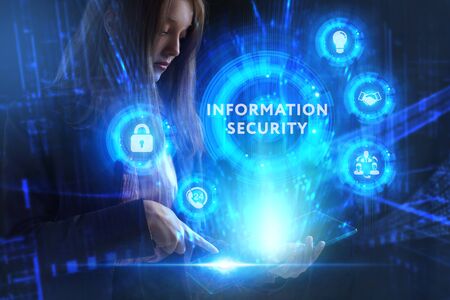 Business, Technology, Internet and network concept. Young businessman working on a virtual screen of the future and sees the inscription: Information securityの写真素材
