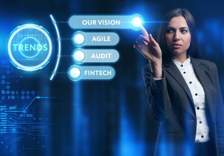 Business, Technology, Internet and network concept. Young businessman working on a virtual screen of the future and sees the inscription: Trendsの写真素材