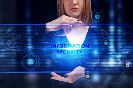 Business, Technology, Internet and network concept. Young businessman working on a virtual screen of the future and sees the inscription: Information securityの写真素材