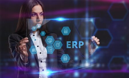 Business, Technology, Internet and network concept. Young businessman working on a virtual screen of the future and sees the inscription:の写真素材