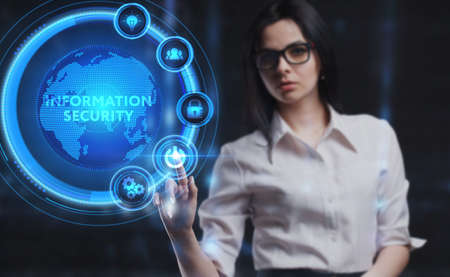 Business, Technology, Internet and network concept. Young businessman working on a virtual screen of the future and sees the inscription: Information securityの写真素材