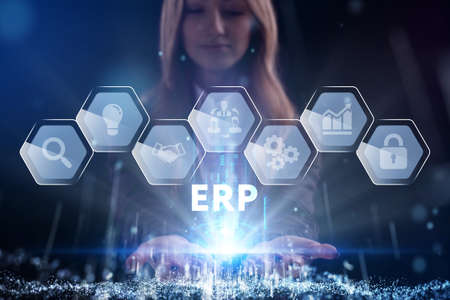 Business, Technology, Internet and network concept. Young businessman working on a virtual screen of the future and sees the inscription: ERPの写真素材