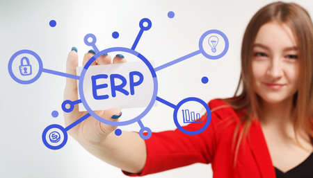Business, Technology, Internet and network concept. Young businessman working on a virtual screen of the future and sees the inscription: ERPの写真素材