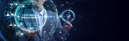 The concept of business, technology, the Internet and the network. A young entrepreneur working on a virtual screen of the future and sees the inscription: Continuous improvementの写真素材