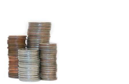 stack of coins over white with copy space