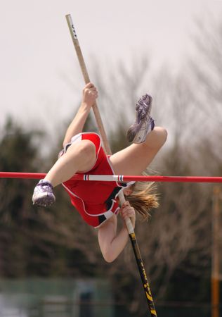 Girl pole vaults
