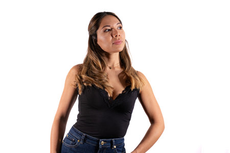 thinking woman posing camera with white backgroundの写真素材