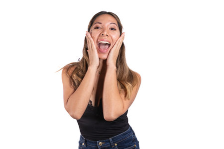 surprised latina woman posing camera with white backgroundの写真素材