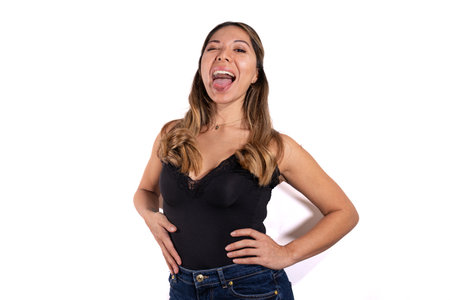 latina woman posing camera with white backgroundの写真素材