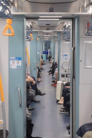 Commuters Legs inside Busy Subway Car
