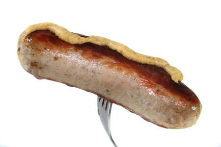 a bratwurst on a forkの写真素材