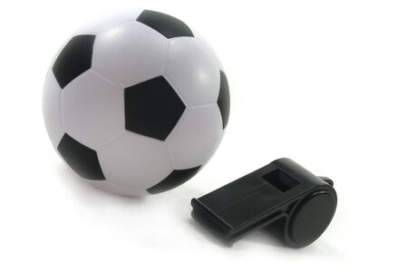 Football with black whistle on a white backgroundの写真素材