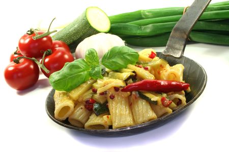 Tortiglione with fiery chili, garlic, zucchini and herbsの写真素材