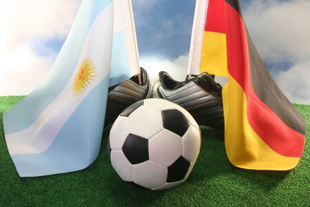 Flag of Argentina and Germany, with football in a fieldの写真素材