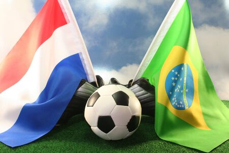 Flag of Netherlands and Brazil, with football in a fieldの写真素材