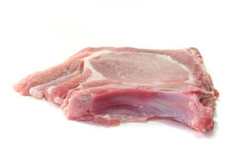 raw pork chop on a white backgroundの写真素材