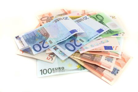 a big pile of euro notes on a white backgroundの写真素材