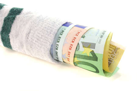 Striped money sock with many euro notes on a white backgroundの写真素材