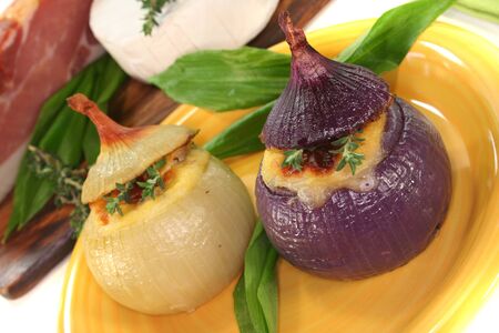 stuffed onions with goat cheese, bacon and thymeの写真素材
