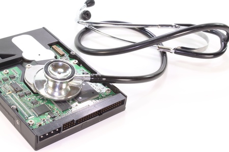 Hard disk with stethoscope on a white background